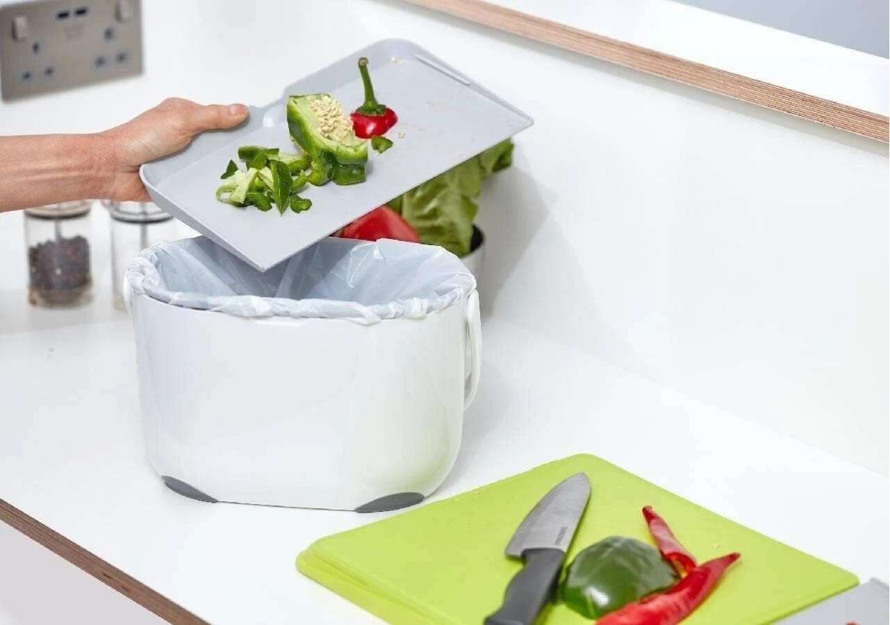 Addis Chop & Swipe Chopping Board Space Saving Design with easy pour side trays